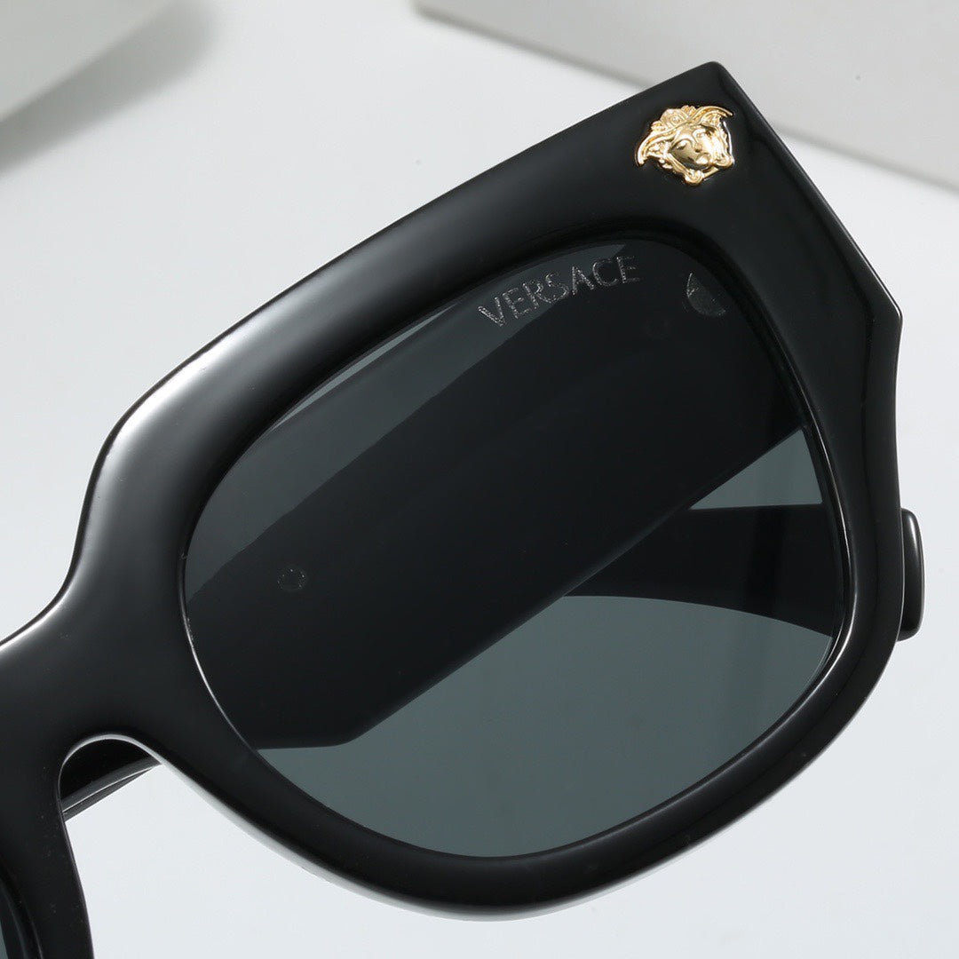 Lunettes de soleil à monture épaisse
